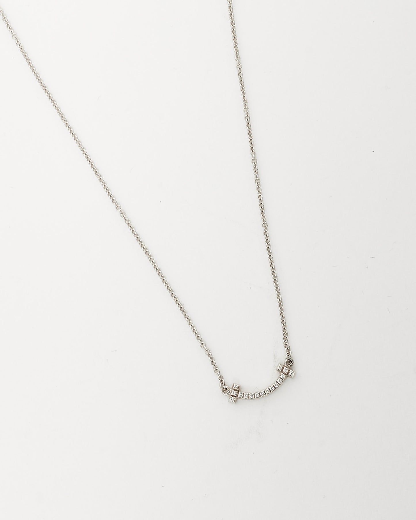 Tiffany 
Co. White Gold 
Diamond Mini T Smile Pendant Necklace