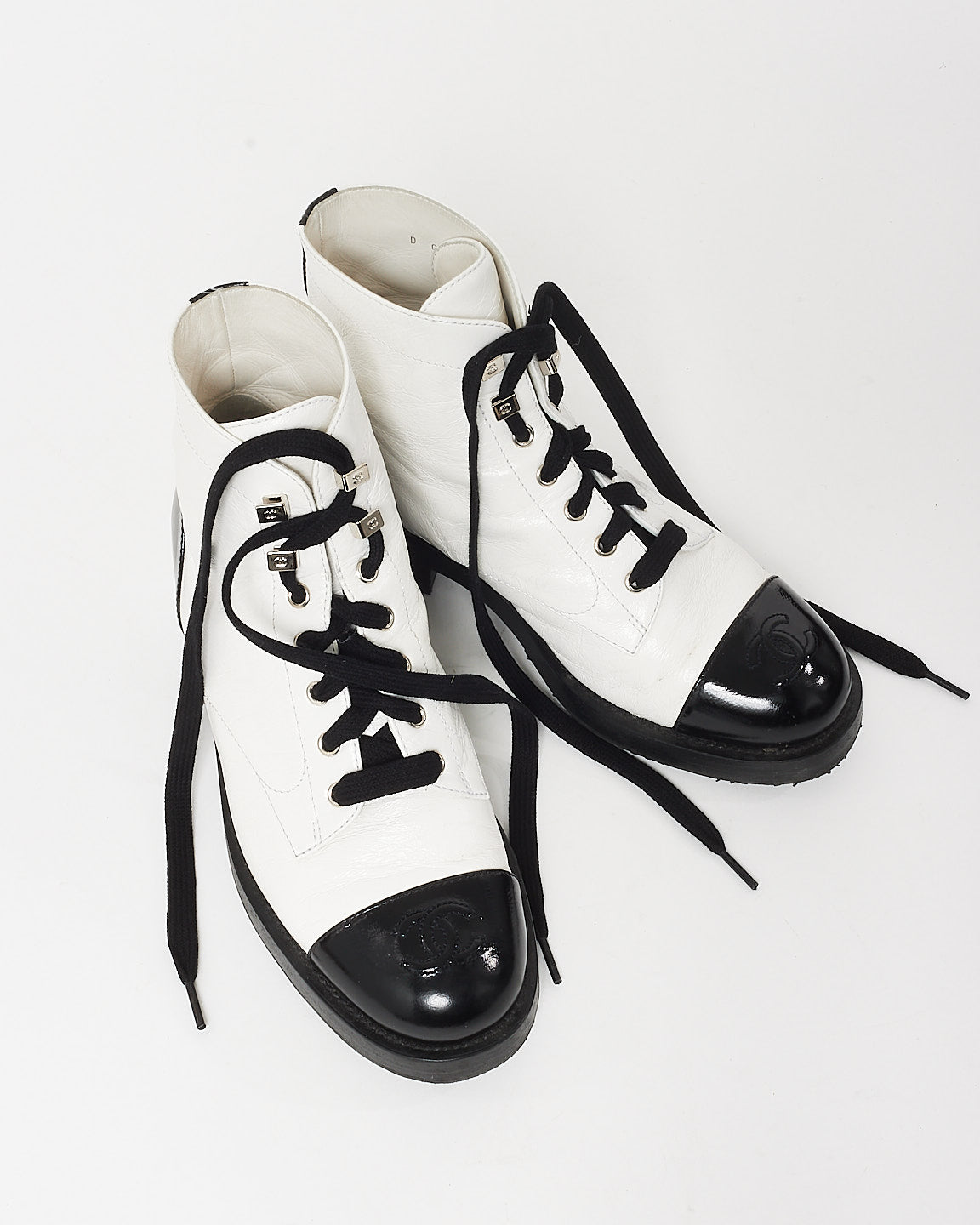 Chanel White Leather 
Black Cap Toe Combat Boots - 37.5