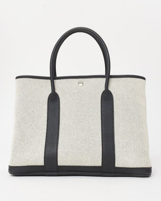 Hermès Cream Canvas 
Black Leather Garden Party 36 Tote Bag