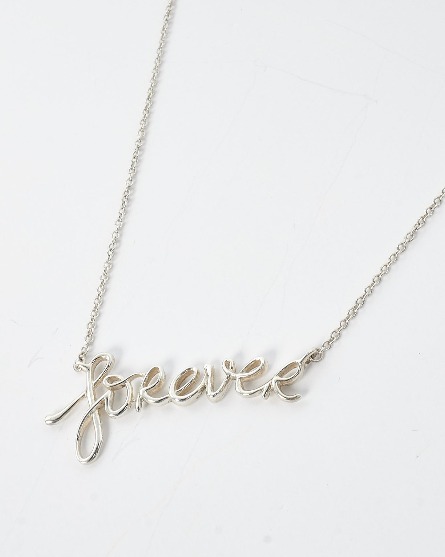 Tiffany 
Co. Silver Paloma
s Graffiti Cursive Forever Necklace