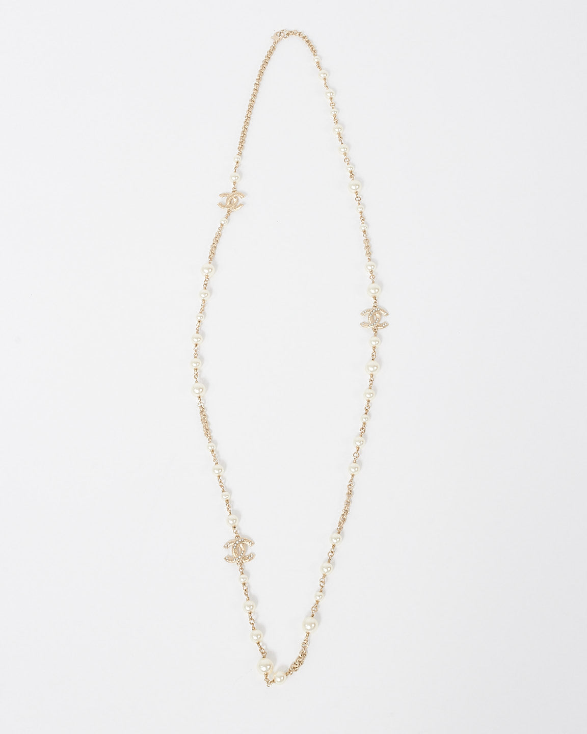 Chanel Pearl 
Gold CC Interlocking Long Station Necklace