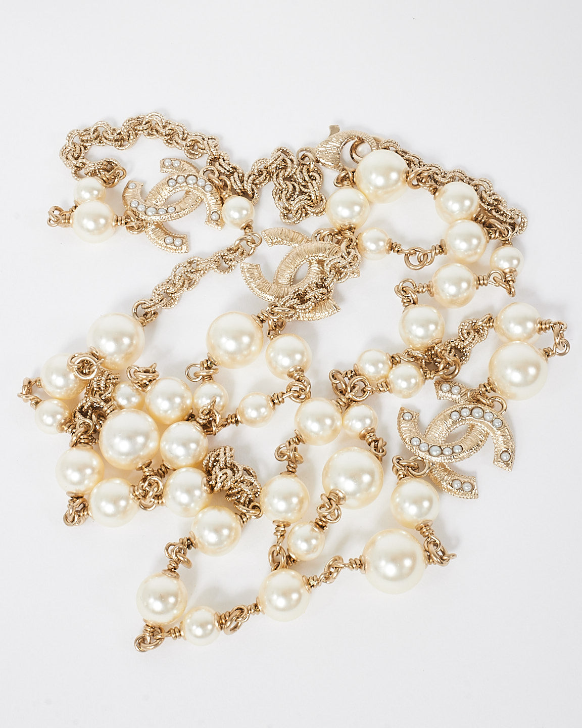 Chanel Pearl 
Gold CC Interlocking Long Station Necklace