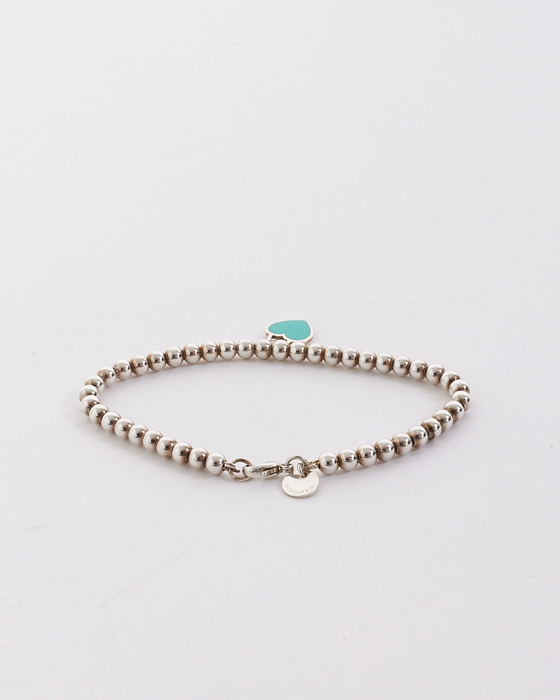 Tiffany 
Co. Silver Blue Heart Tag Bead Bracelet